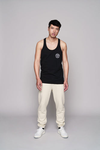 front of black tank with golds plate logo on left chest
