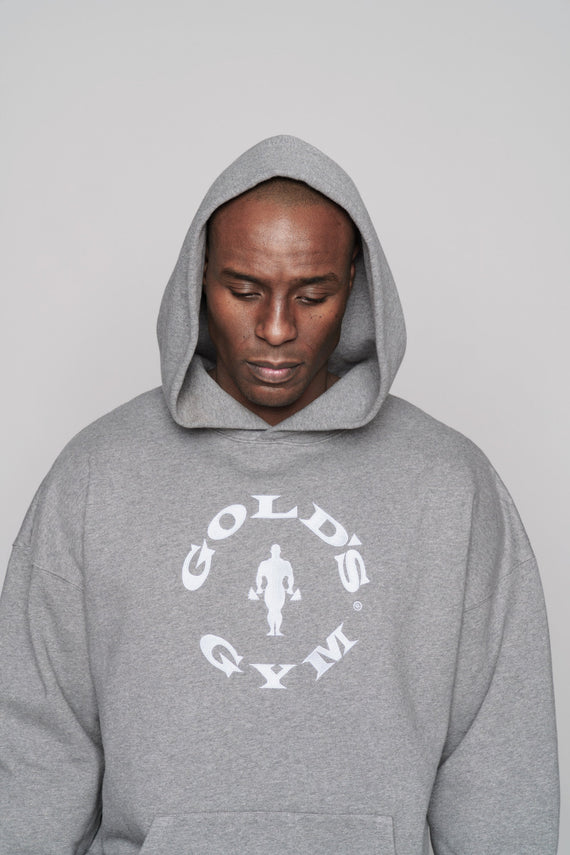 front closeup of grey oversize heavyweight hoodie with white golds gym logo