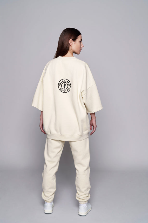 back of white oversize shortsleeve fleece crew with black golds logo on back